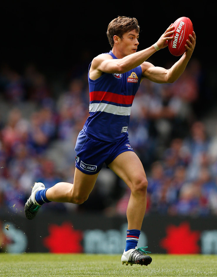 AFL 2016 Rd 01 - Western Bulldogs v Fremantle MELBOURNE, AUSTRALIA - MARCH 27: Debutant, Josh Dunkley of the Bulldogs in action during the 2016 AFL Round 01 match between the Western Bulldogs and the Fremantle Dockers at Etihad Stadium, Melbourne on March 27, 2016. (Photo by Michael Willson/AFL Media)
